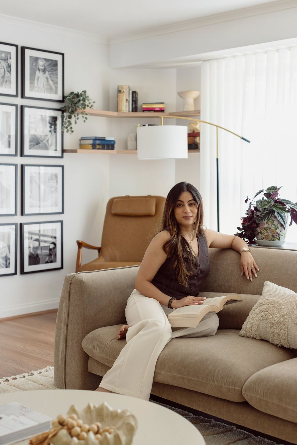 Srishti, founder of Snug Nest Designs, in a finished living room